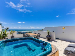 Luxury Oceanfront Haven with a Private Rooftop Spa